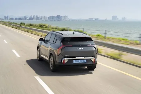 Kia EV3 driving along a coastal road